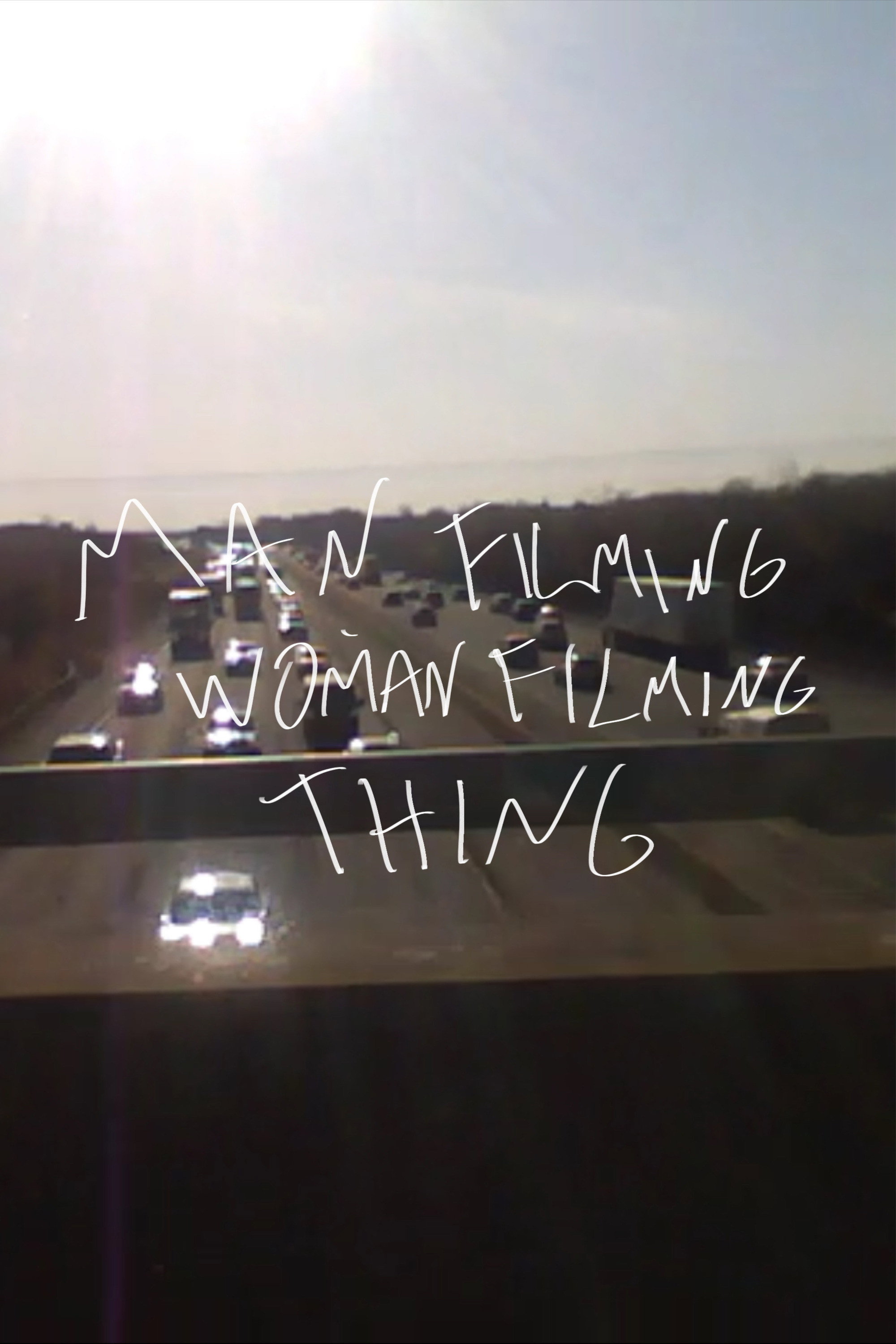 Man Filming Woman Filming Thing