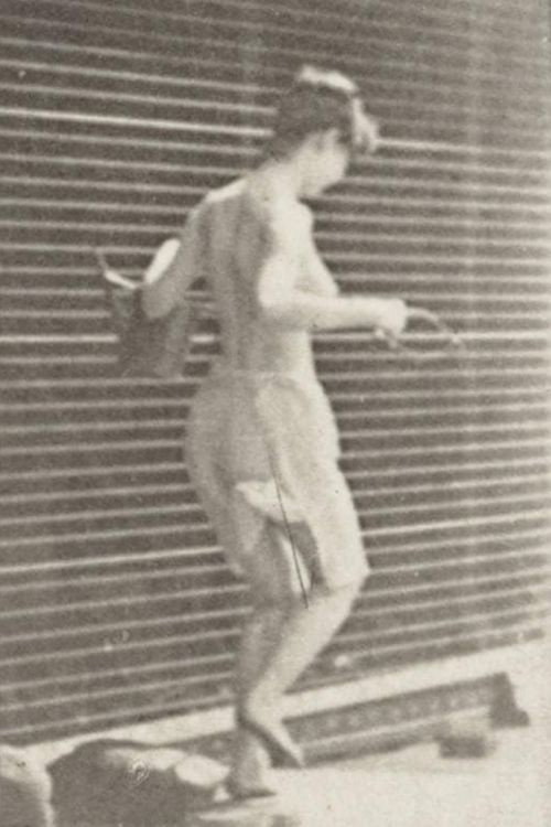 Woman Crossing Brook on Stepping-Stones with a Fishing Pole and a Can