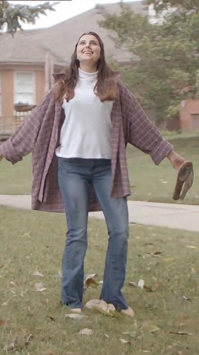 A Girl Walks Along the Street